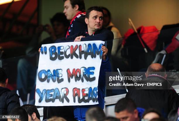 Fan holds up a David Beckham sign in the stands