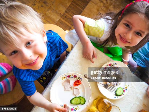 children eat and laugh - small dinner party stock pictures, royalty-free photos & images