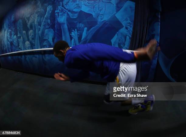 Stephen Curry of the Golden State Warriors runs up the tunnel after signing autographs prior to Game Two of the NBA Western Conference Semi-Finals...