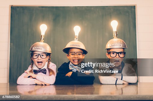 Three Young Nerds with Thinking Caps Three Young Nerds with Thinking Caps