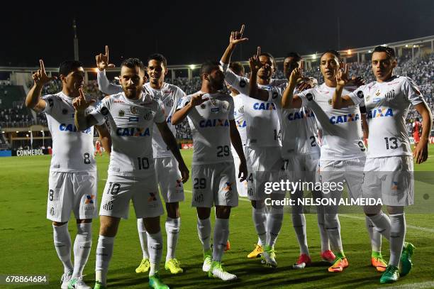 Ricardo Oliveira of Brazils Santos, celebrates his goal with teammates scored against Colombias Santa Fe, during their 2017 Copa Libertadores...