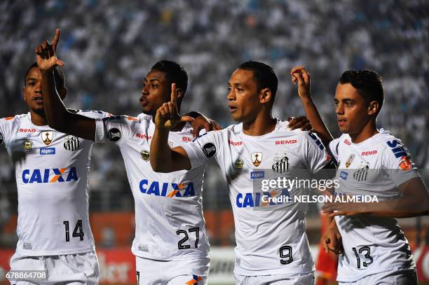 Ricardo Oliveira of Brazils Santos, celebrates with teammates after scoring against Colombias Santa Fe, during their 2017 Copa Libertadores football...