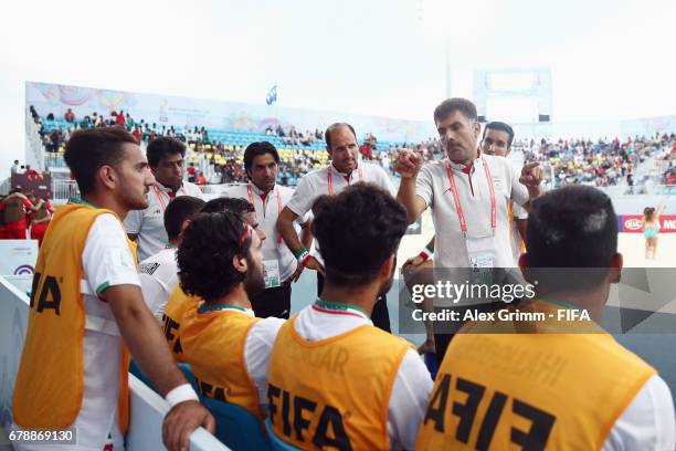 Head coach Mohammad Mirshamsi of Iran talks to the team during the FIFA Beach Soccer World Cup Bahamas 2017 quarter final match between Winner Group...