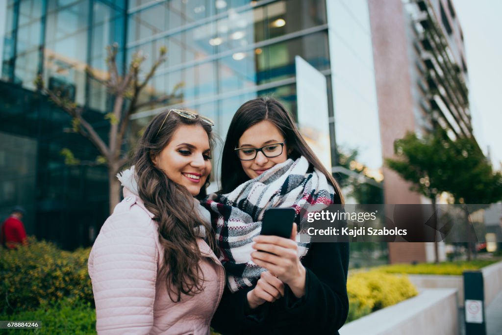 Women using smart phone in budapest