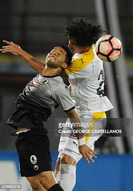 Venezuela's Zamora player Angel Faria vies for the ball with Paraguay's Guarani player Juan Aguilar during their Copa Libertadores 2017 football...