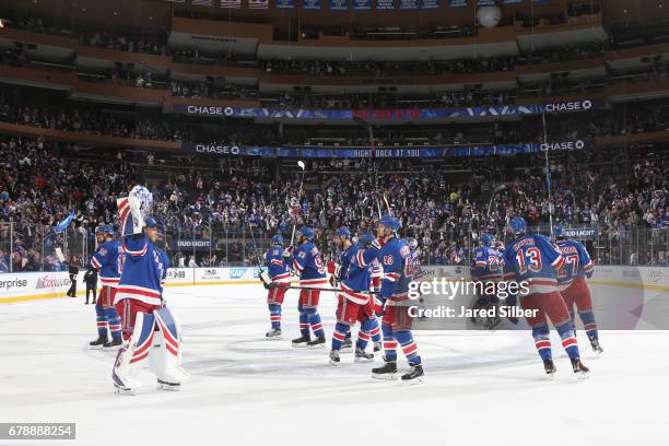 The New York Rangers celebrate after defeating the Ottawa Senators 4-1 in Game Four of the Eastern Conference Second Round during the 2017 NHL...
