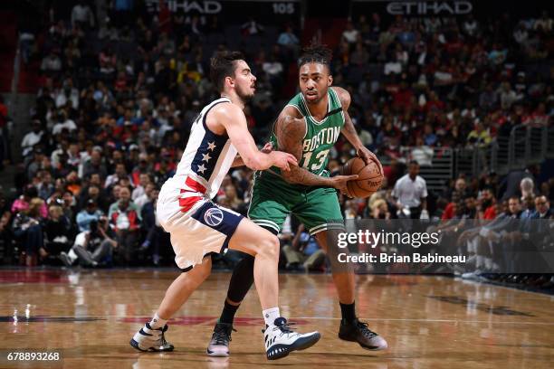 James Young of the Boston Celtics handles the ball during the game against the Washington Wizards during Game Three of the Eastern Conference...