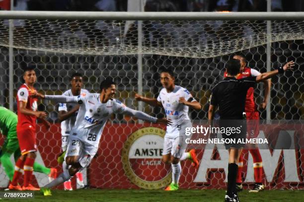 Lucas Verissimo of Brazils Santos celebrates his goal scored against Colombias Santa Fe during their 2017 Copa Libertadores football match held at...