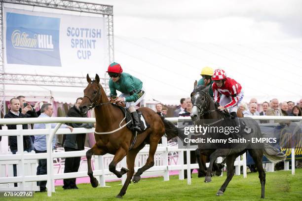 Royal Skies ridden by jockey Joe Fanning , Dorfman ridden by Adrian Nicholls and Eric The Grey ridden by Tom Eaves during the William Hill - In The...