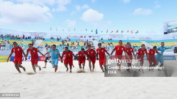 The team of Tahati celebrate victory in the FIFA Beach Soccer World Cup Bahamas 2017 quarter final match between Paraguay and Tahiti at National...