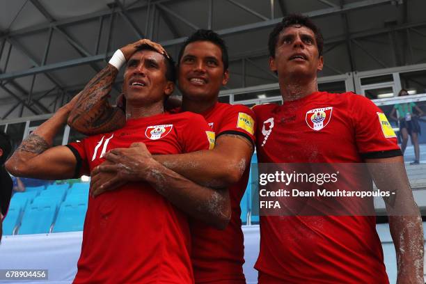 Captain, Naea Bennett , Teva Zaveroni and Ariihau Teriitau of Tahati celebrate on the bench after victory in the FIFA Beach Soccer World Cup Bahamas...