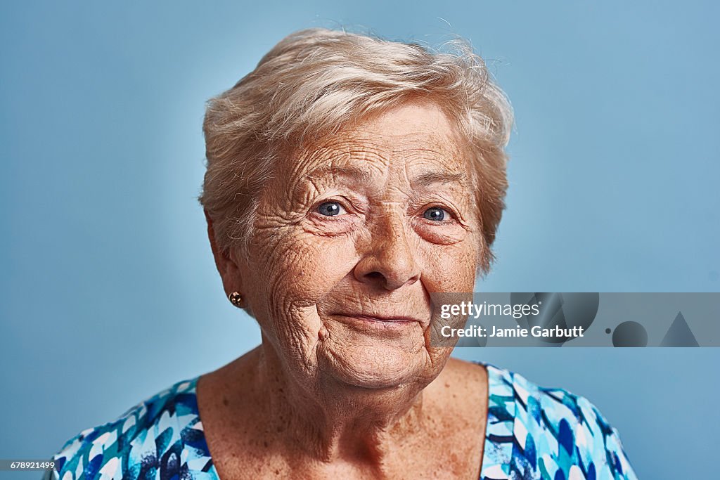 Close up studio portrait of a late 70's female