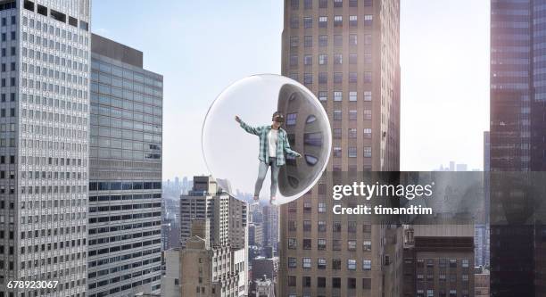 young woman having a virtual reality experience - floating city stock pictures, royalty-free photos & images