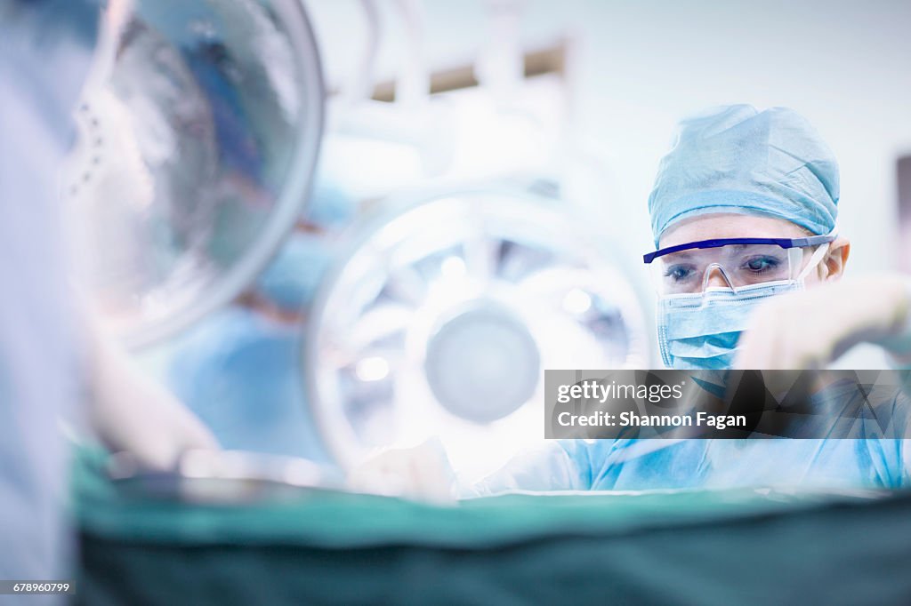 Surgeon performing operation in operating room