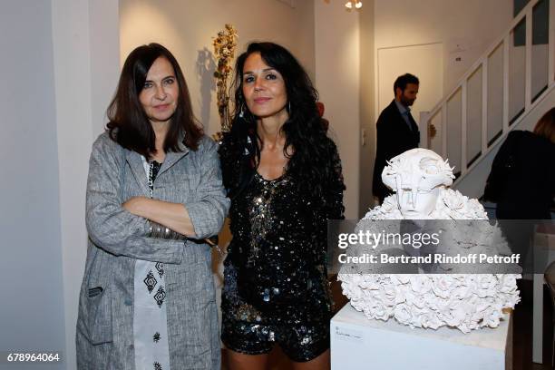 Nathalie Garcon and actress Catherine Wilkening attend Catherine Wilkening signs her book "Les mots avales" and exhibits her works at Galerie...