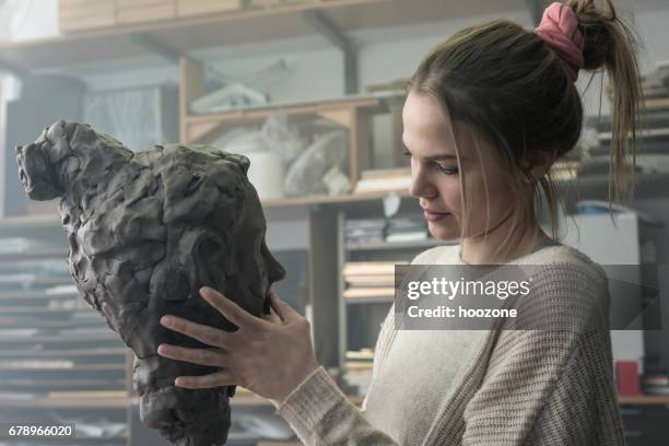 young sculptor creates a clay sculpture - sculptor stock pictures, royalty-free photos & images