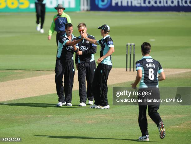 Surrey's Zander de Bruyn celebrates taking the wicket of Tom Poynton LBW