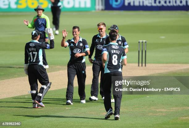 Surrey's Zander de Bruyn celebrates taking the wicket of Tom Poynton LBW