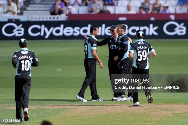 Surrey's Zander de Bruyn celebrates taking the wicket of Tom Poynton LBW