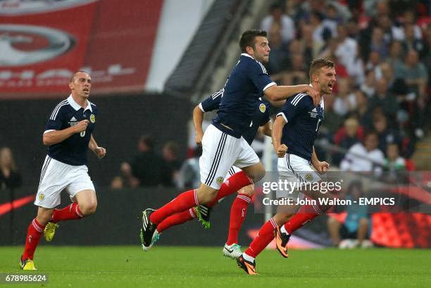 Scotland's James Morrison celebrates scoring his teams first goal of the game with teammate Russell Martin