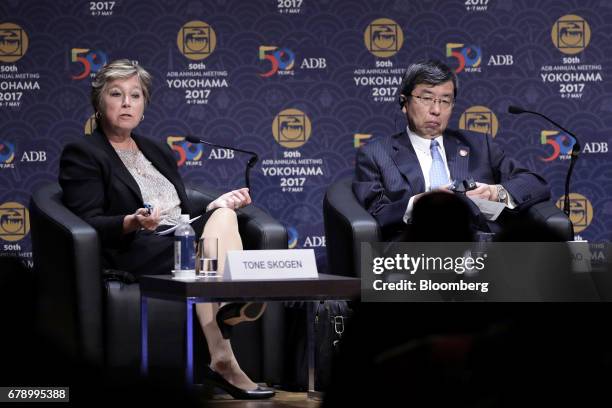 Tone Skogen, state secretary at Norway's ministry of foreign affairs, left, speaks while Takehiko Nakao, president of the Asian Development Bank ,...