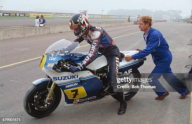 British racing motorcyclist Barry Sheene is pushed out on his Heron DAF Suzuki 500cc motorcycle during the International Gold Cup meeting at...
