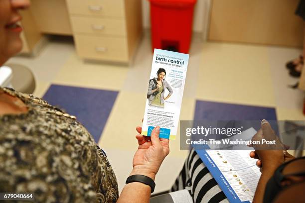 Kayjanet Moore of Denver, Co. Has birth control options explained to her by social worker Cindy Covell of Denver, Co. At Children's Hospital...