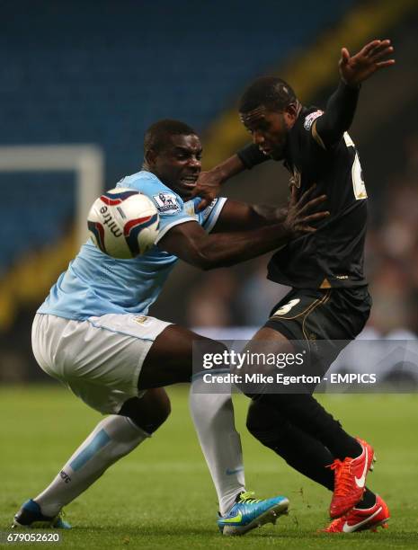 Manchester City's Micah Richards and Wigan Athletic's Juan Garcia.