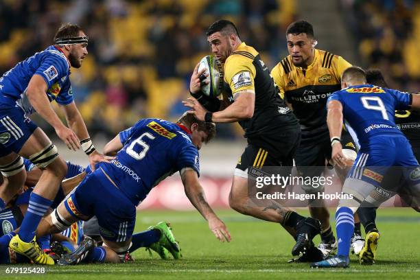 Jeffery To'omaga-Allen of the Hurricanes find s gap during the round 11 Super Rugby match between the Hurricanes and the Stormers at Westpac Stadium...