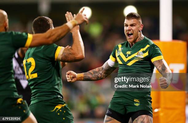 Josh Dugan of Australia celebrates scoring a try during the ANZAC Test match between the Australian Kangaroos and the New Zealand Kiwis at GIO...