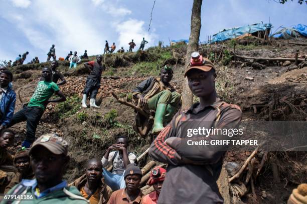 Artisanal miners rest at Kacuba cassiterite mine near Nzibira, south-west of Bukavu, in Democratic Republic of Congo, on March 29, 2017. - In the...