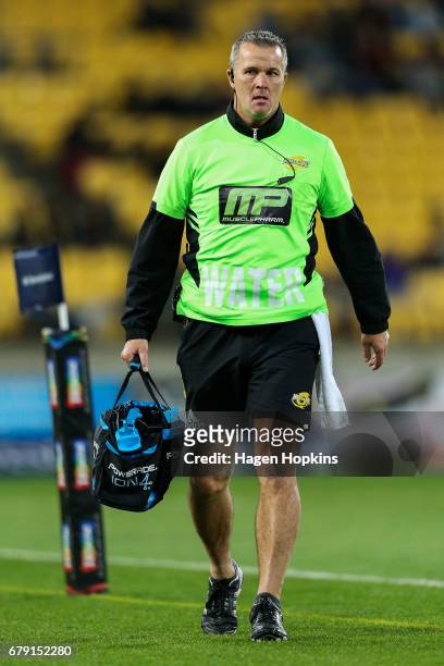 Technical Advisor Richard Watt of the Hurricanes returns to the bench during the round 11 Super Rugby match between the Hurricanes and the Stormers...
