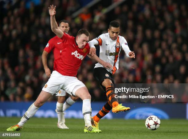 Shakhtar Donetsk's Santos Alex Teixeira and Manchester United's Phil Jones battle for the ball