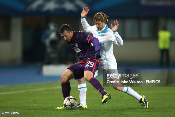 Austria Vienna's Markus Suttner shields the ball from Zenit St Petersburg's Cristian Ansaldi