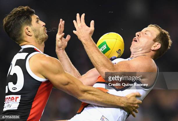 Steve Johnson of the Giants marks infront of Koby Stevens of the Saints during the round seven AFL match between the St Kilda Saints and the Greater...