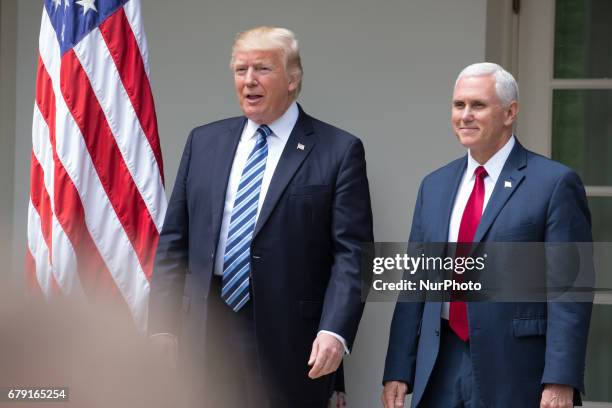 President Trump, and VP Mike Pence walk out of the White House Oval office to the Rose Garden, for the National Day of Prayer ceremony, on Thursday,...