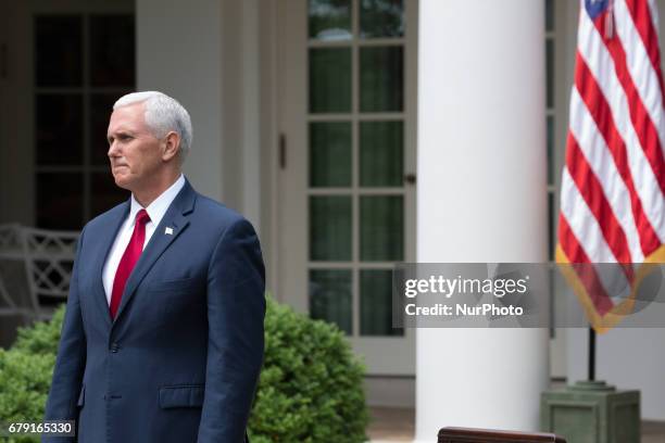 Mike Pence listens to President Trump speak, at the National Day of Prayer ceremony, in the Rose Garden of the White House, On Thursday, May 4, 2017.