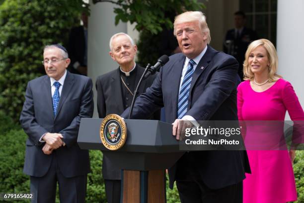 President Donald Trump spoke, with Rabbi Marvin Hier, Cardinal Donald Wuerl, Pastor Jack Graham, and Pastor Paula White at his side, at the National...