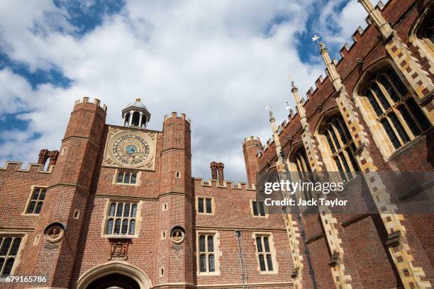 The astronomical clock sits on the Anne Boleyn Gatehouse at Hampton Court Palace on May 5, 2017 in London, England. The astronomical clock, which...