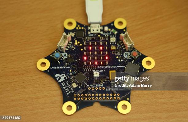 Child uses a "Calliope mini" computer during a demonstration of the device on May 5, 2017 in Berlin, Germany. The USB-connected circuit board,...