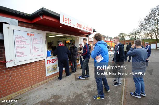 Fans queue for refreshments before the game