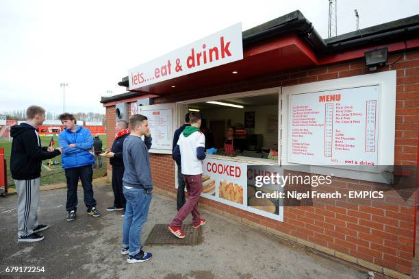 Fans queue for refreshments before the game