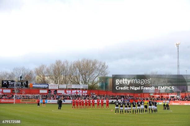 Tamworth and Bristol City players observe a minute's applause before the game in honour of Nelson Mandela