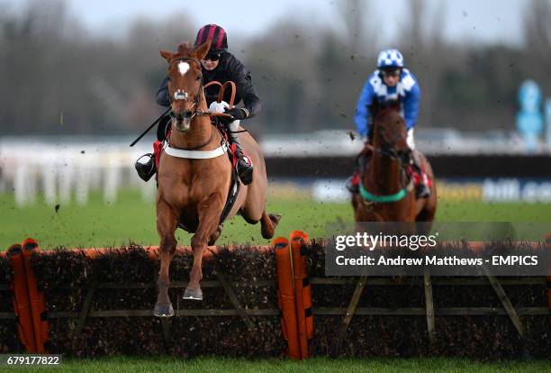 Three Kingdoms ridden by jockey Jack Quinlan jumps the last to go on and win the William Hill - In The App Store Handicap Hurdle during day two of...