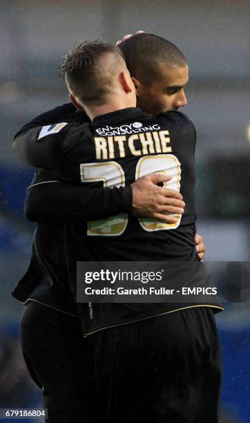 Bournemouth's Lewis Grabban is congratulated by Bournemouth's Matt Ritchie after scoring from the penalty spot.