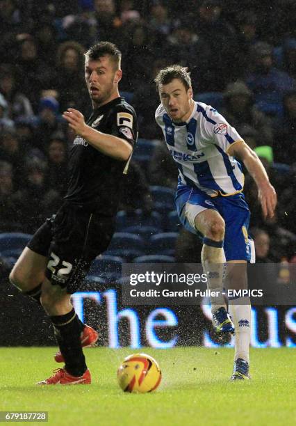 Brighton's Ashley Barnes takes a shot on goal past Bournemouth's Elliott Ward