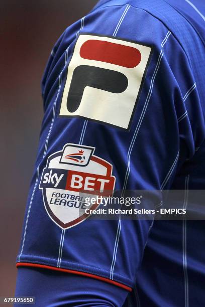 Detail of the Skybet Football League logo on a Carlisle shirt.