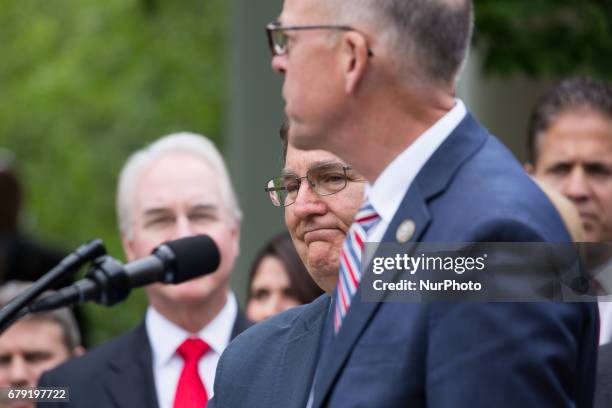 Rep. Mike Burgess , stands with Rep. Greg Walden, , as he speaks at President Trump's press conference with members of the GOP, on the passage of...