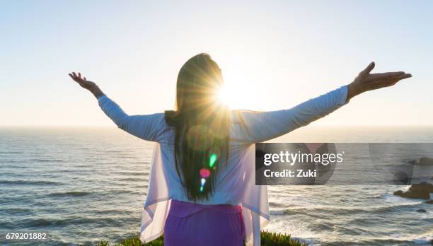 woman in worship - surrendering stock pictures, royalty-free photos & images