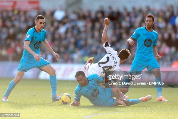 Swansea City's Alejandro Pozuelo and Tottenham Hotspur's Danny Rose battle for the ball